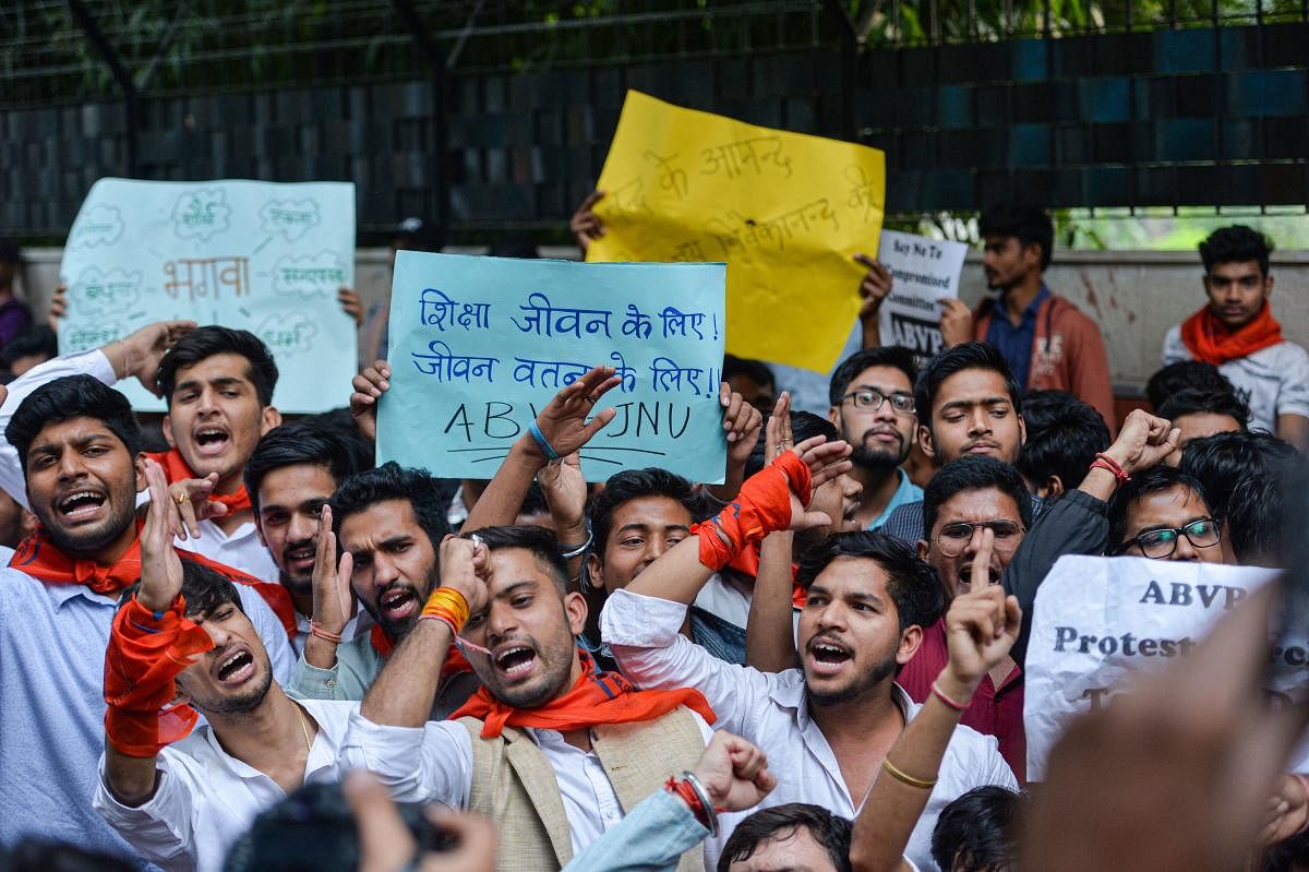 New Delhi: Jawaharlal Nehru University (JNU), Akhil Bharatiya Vidyarthi Parishad (ABVP) and Delhi University Students' Union (DUSU) students raise slogans during a protest march from Mandi House towards Jantar Mantar pressing for their demands, in New Del