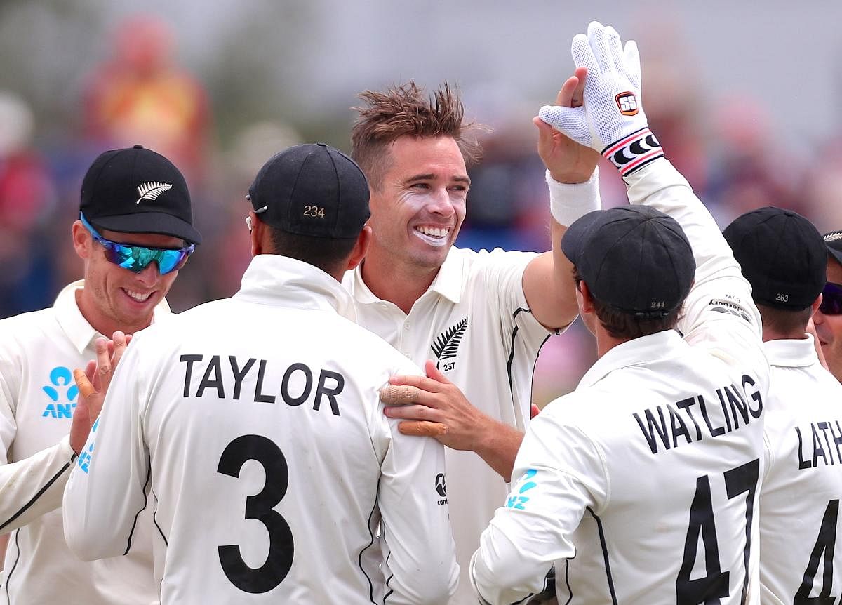 New Zealand's Tim Southee celebrates with teammate Ross Taylor after they dismissed England's Ben Stokes.