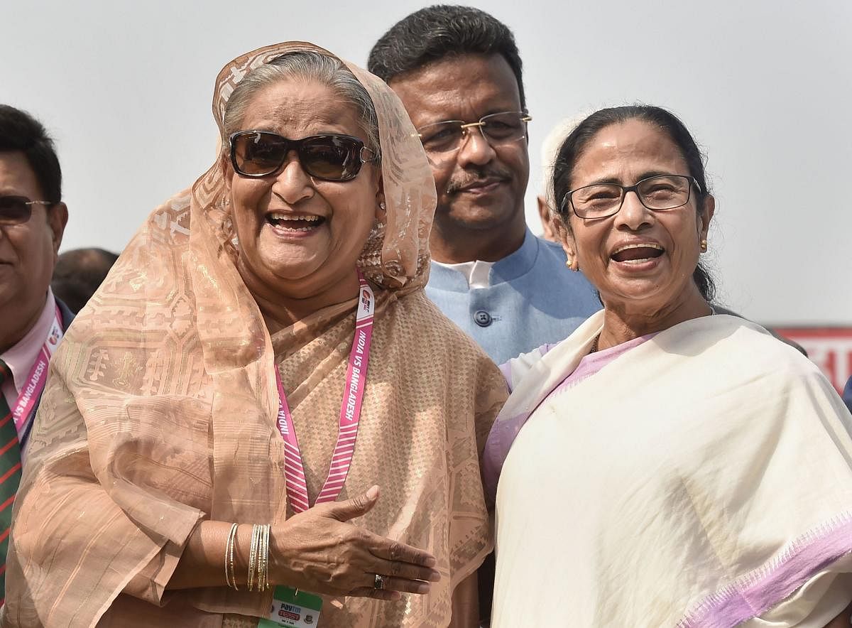 Kolkata: Bangladesh's Prime Minister Sheikh Hasina and West Bengal Chief Minister Mamata Banerjee during the historic pink-ball day/night cricket test match between Indian and Banglades, at the Eden Gardens in Kolkata, Friday, Nov. 22, 2019. (PTI Photo)