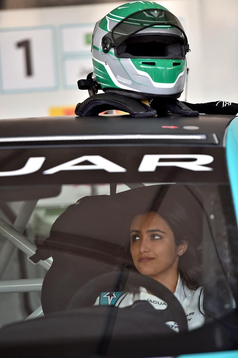 Saudi Arabia's first female race driver Reema al-Juffali is pictured inside her car during an interview with AFP in Diriyah district in Riyadh on November 20, 2019, ahead of the international Jaguar I-PACE eTROPHY series for electric zero-emission cars se