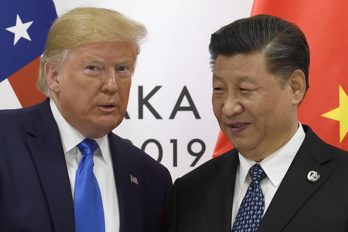 Donald Trump with Xi Jinping. (AP file photo)