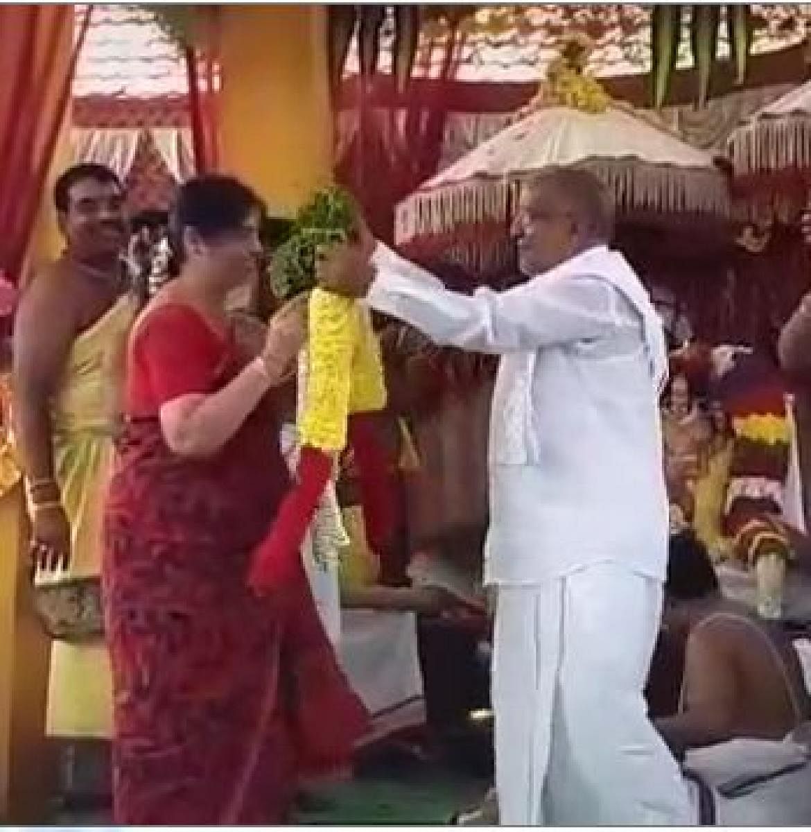 A video grab of JD(S) MLA G T Devegowda and his wife during Srinivasa Kalyanotsava at Dadakalahalli in Mysuru taluk on Friday.