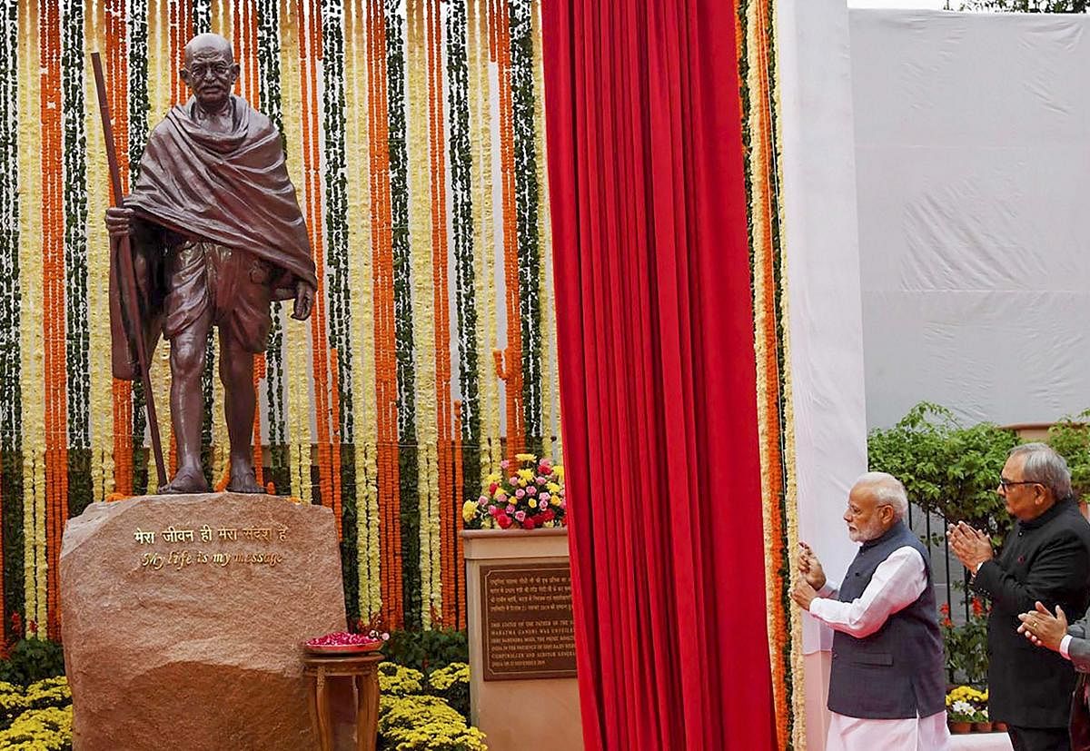 Prime Minister Narendra Modi unveils a statue of Mahatma Gandhi, at the Comptroller and Auditor General of India (CAG) office premises, in New Delhi. Representative Image. (PTI Photo)