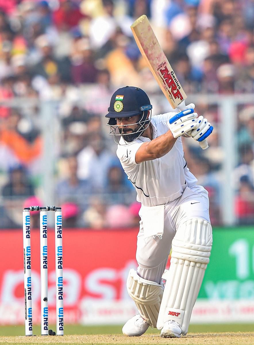 Virat Kohli drives one to the boundary en route to his 136 against Bangladesh on Saturday at the Eden Gardens. PTI