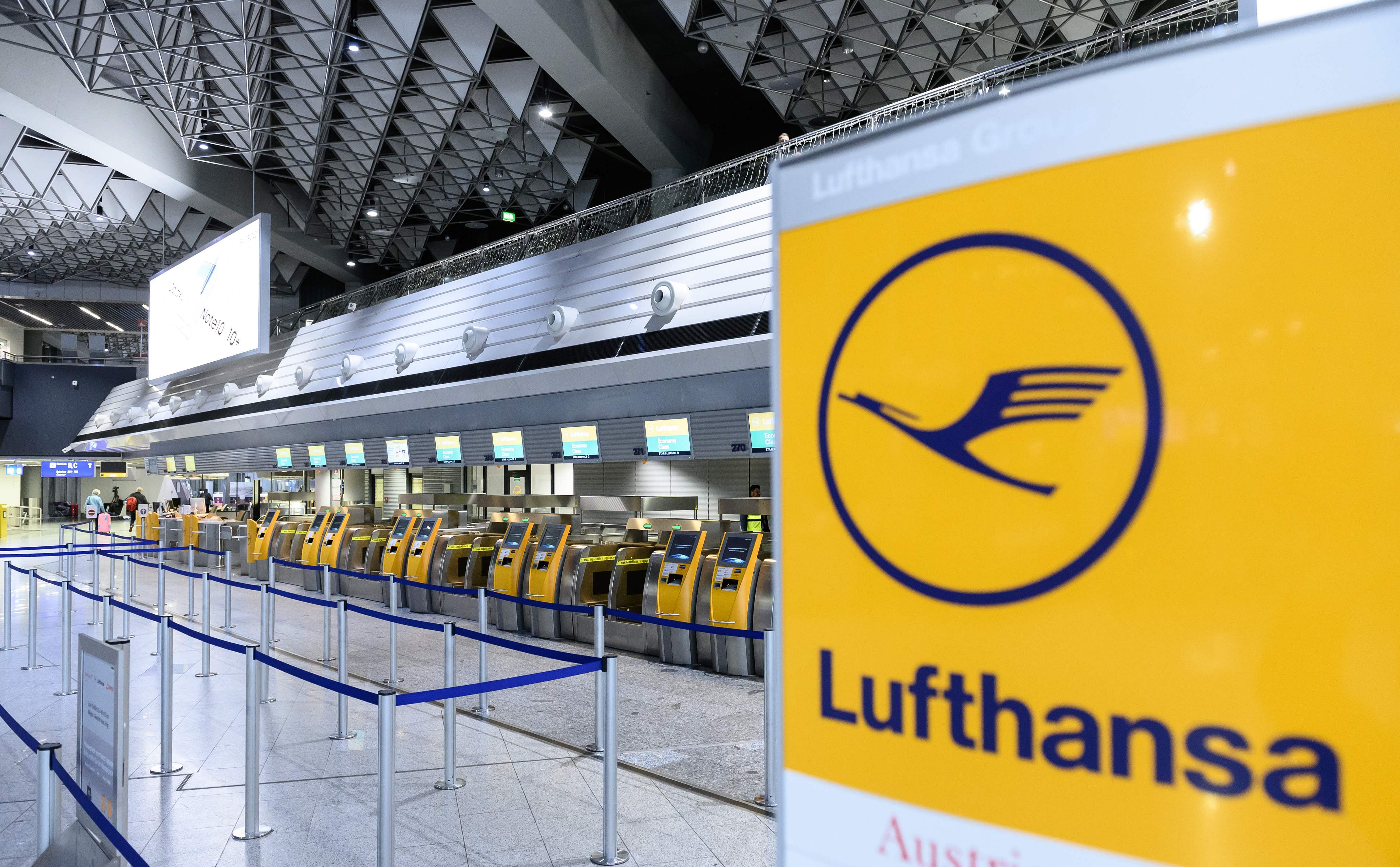 Deserted check-in desks of German airline Lufthansa are seen at the airport in Frankfurt am Main, western Germany. (AF Photo)