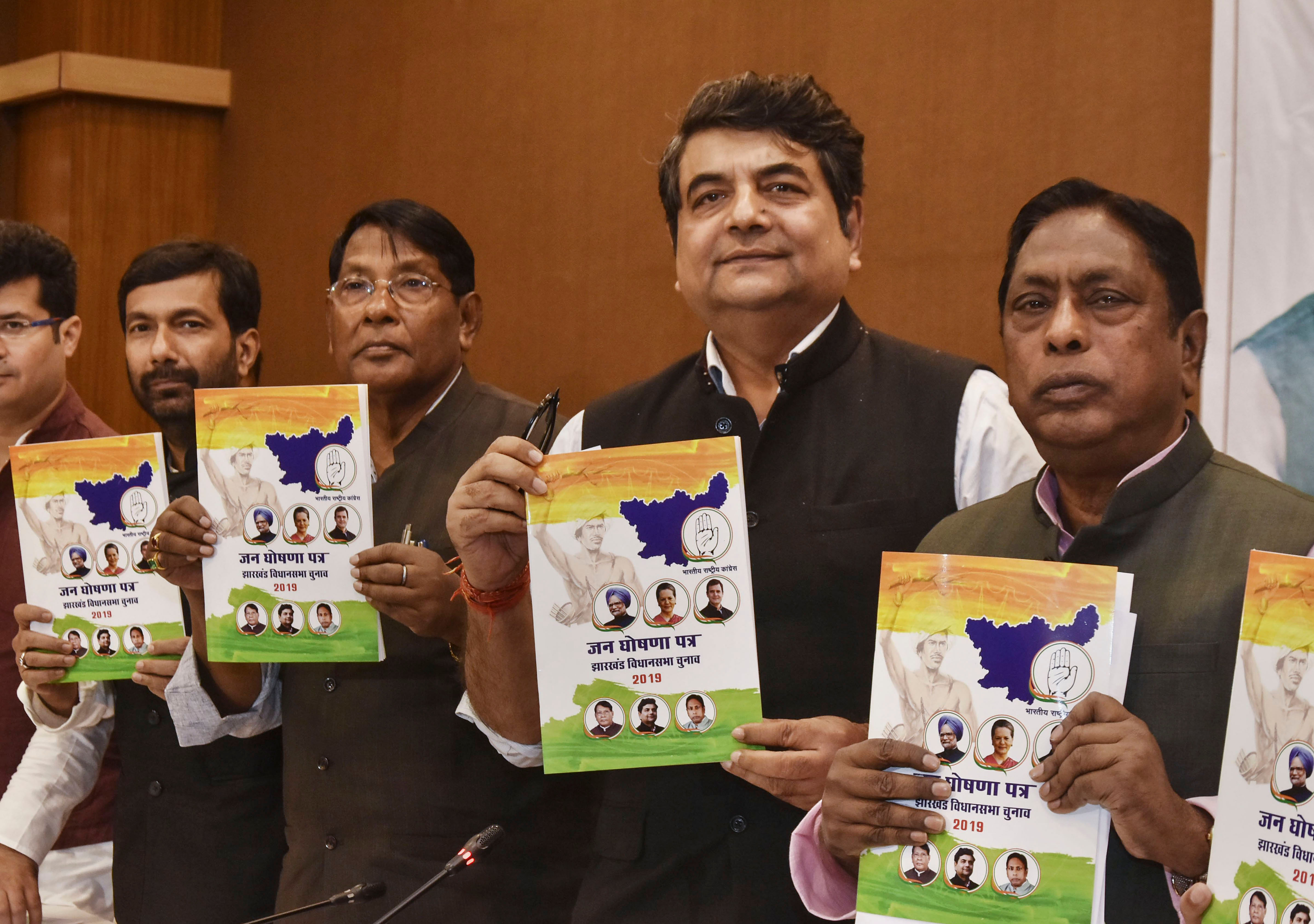 Jharkhand Congress in-charge RPN Singh, state Congress President Rameshwar Oraon and others release party's manifesto for Jharkhand Assembly elections, in Ranchii. (PTI Photo)