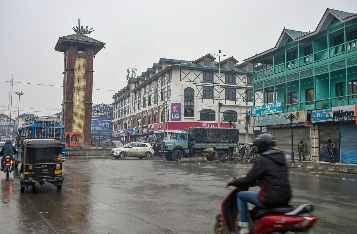 Traffic ply on roads at Lal Chowk during shutdown in Srinagar, Thursday, Nov. 21, 2019. The shutdown was intensified a day after threatening posters appeared in the many parts of the Valley. (PTI Photo)