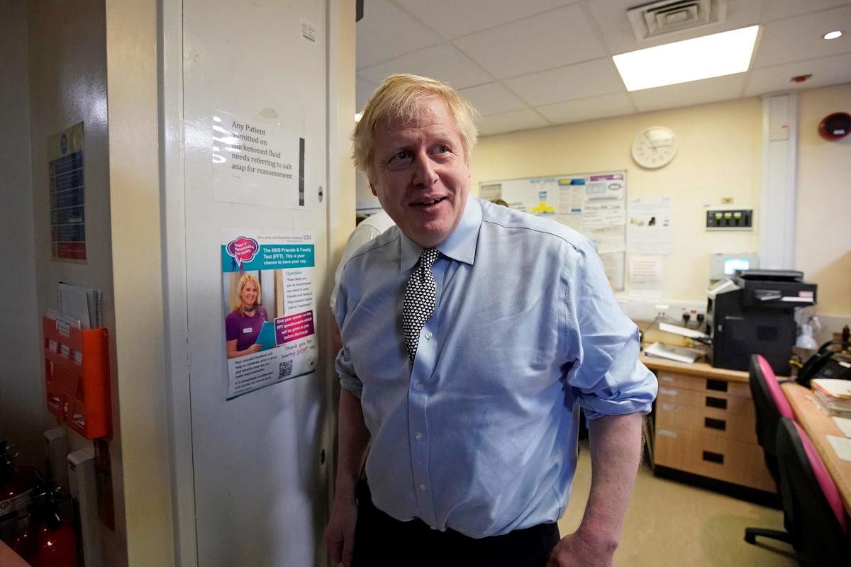 Britain's Prime Minister Boris Johnson reacts during a Conservative Party general election campaign visit to Bassetlaw District General Hospital in Worksop, central England.