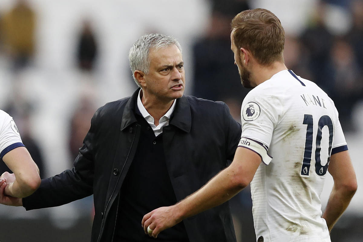 Tottenham Hotspur's Portuguese head coach Jose Mourinho interacts with Tottenham Hotspur's English striker Harry Kane at the final whistle during the English Premier League football match between West Ham United and Tottenham Hotspur at The London Stadium, in east London. (AFP Photo)