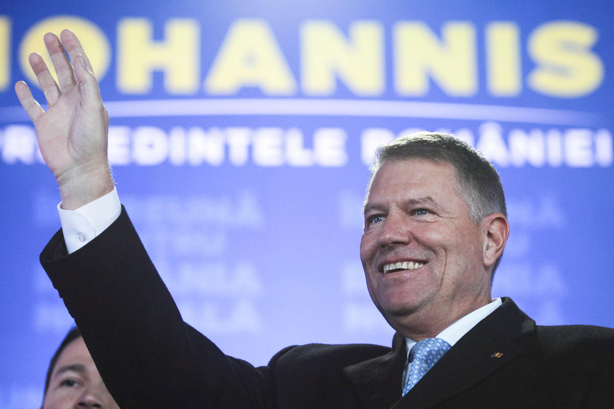 Incumbent candidate Klaus Iohannis reacts after receiving the first exit poll results following the second round of a presidential election in Bucharest. (Reuters photo)