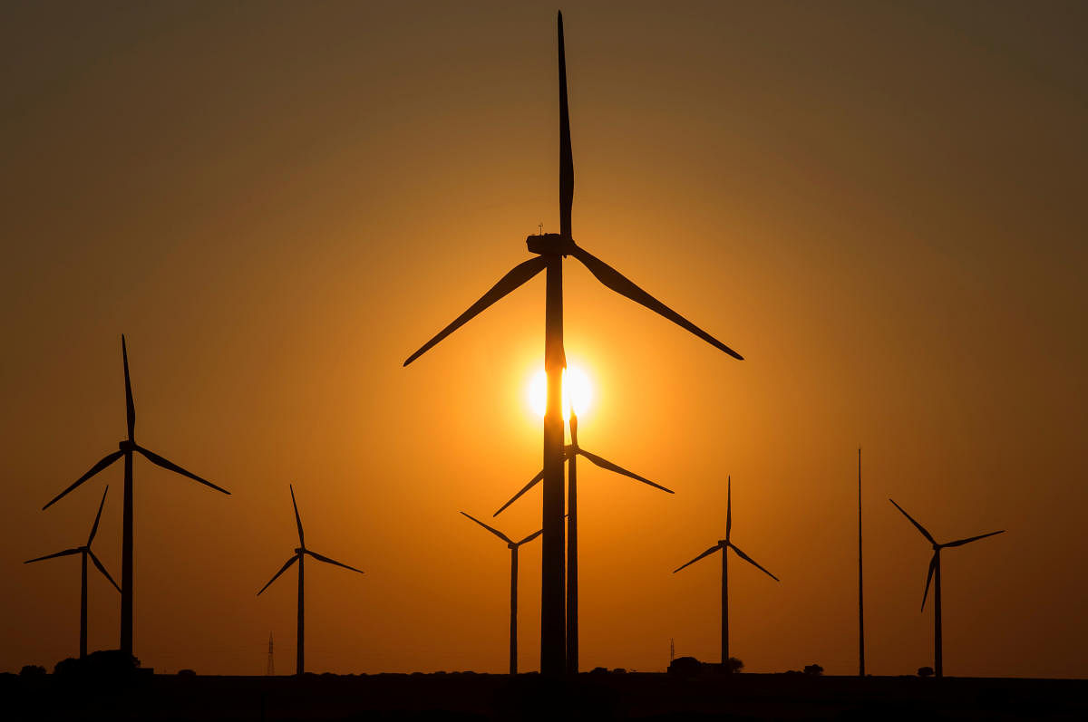 Wind turbines are seen at dusk in a field in Tebar, Spain, April 11, 2017. (Reuters Photo)