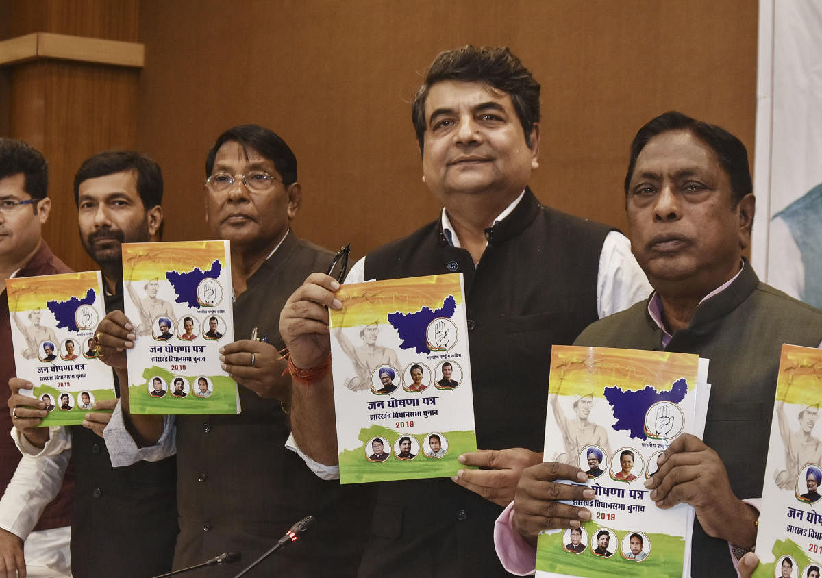 Jharkhand Congress in-charge RPN Singh, state Congress President Rameshwar Oraon and others release party's manifesto for Jharkhand Assembly elections, in Ranchi, Sunday, Nov. 24, 2019. (PTI Photo)