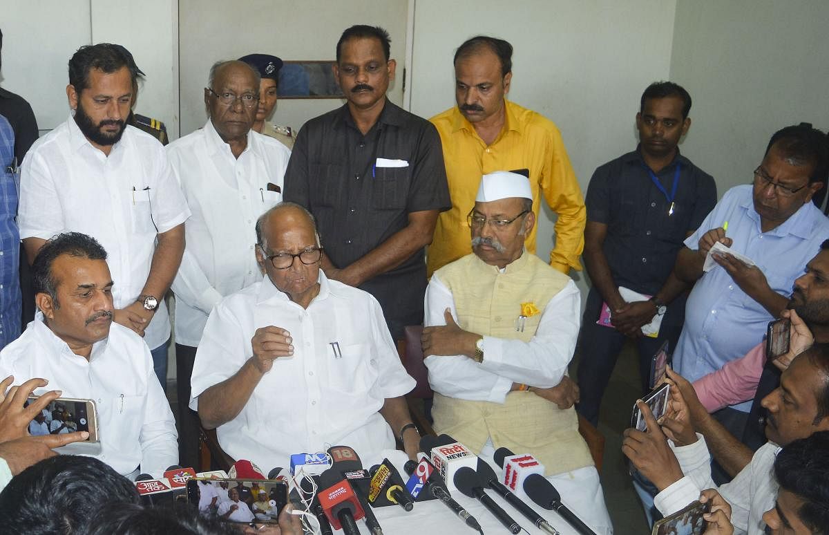 NCP President Sharad Pawar interacts with the media over the Maharashtra government formation issue, in Karad. PTI