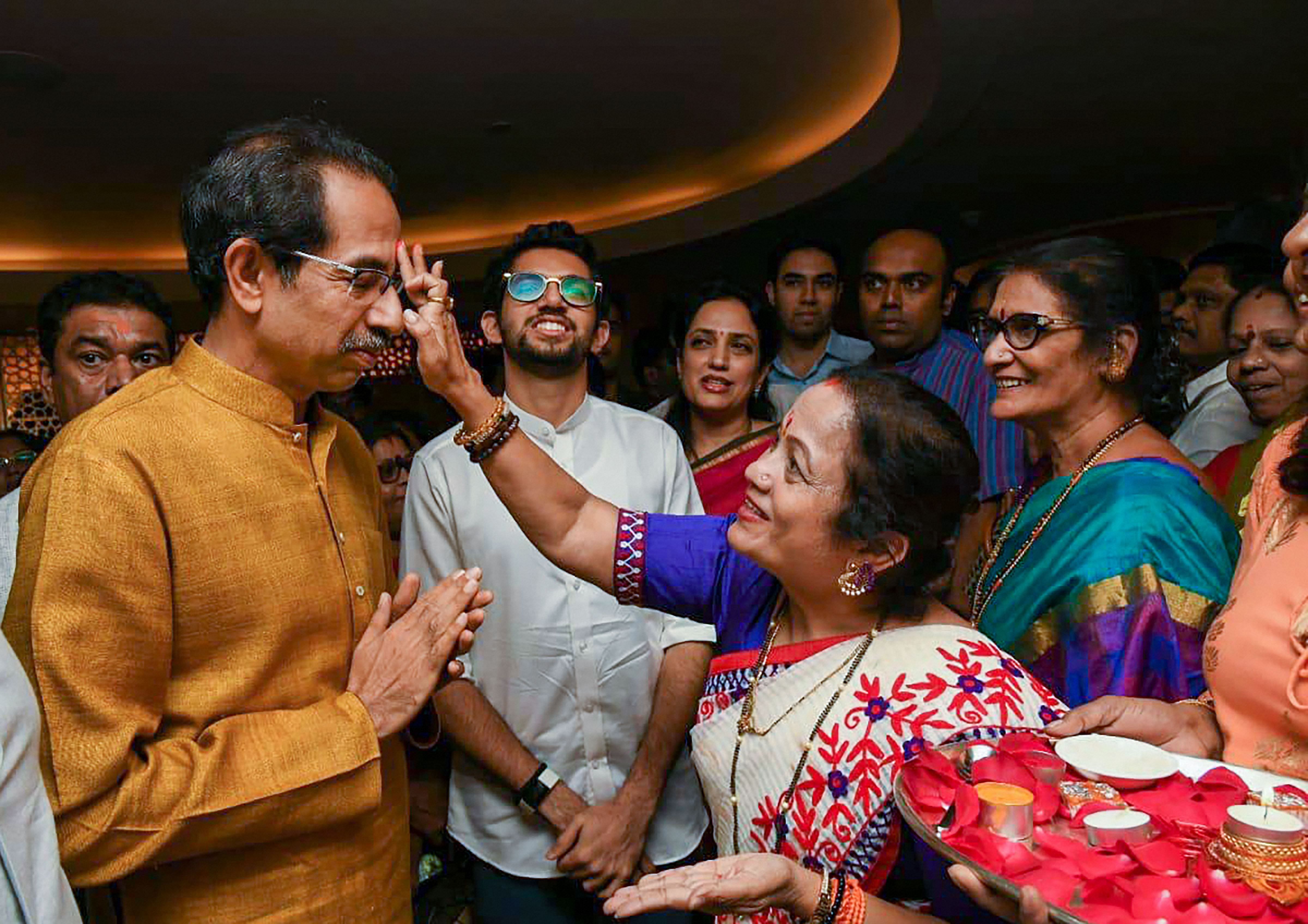 Shiv Sena President Uddhav Thackeray being greeted after he was chosen as the nominee for Maharashtra chief minister's post by Shiv Sena-NCP-Congress alliance. (PTI Photo)