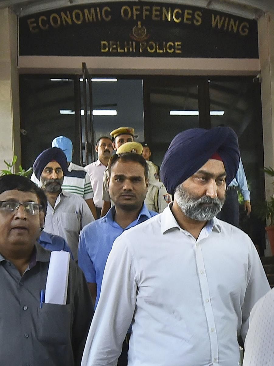 In this Oct. 11, 2019 file photo, former promoter of pharmaceutical giant Ranbaxy Malvinder Singh being arrested by the Economic Offences Wing (EOW) of Delhi Police in New Delhi. The ED on Thursday, Nov. 14, 2019 arrested Singh and former CMD of Religare