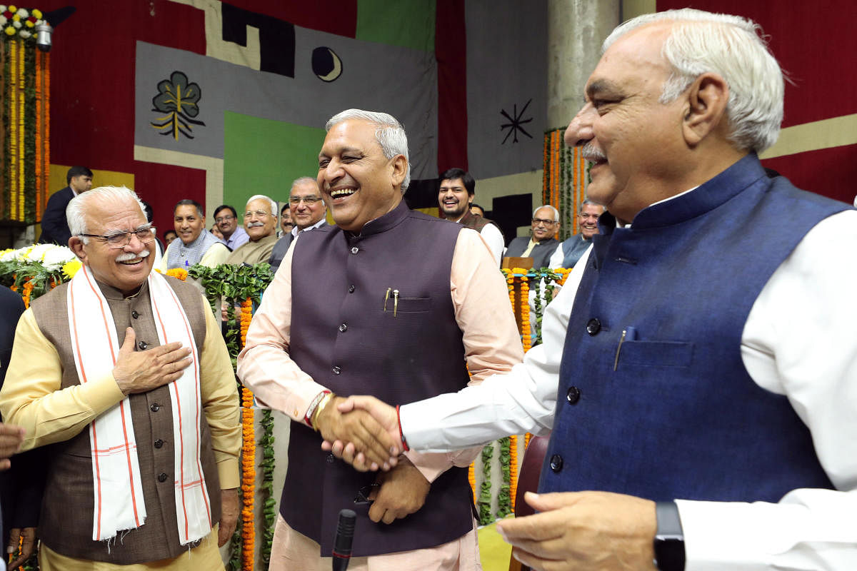 Newly-elected Haryana Vidhan Sabha Deputy Speaker Ranbir Singh Gangwa Prajapati being greeted by Haryana Chief Minister Manohar Lal Khattar and former chief minister Bhupinder Singh Hooda during state Assembly Session, in Chandigarh, Tuesday, Nov. 26, 2019. (PTI Photo)