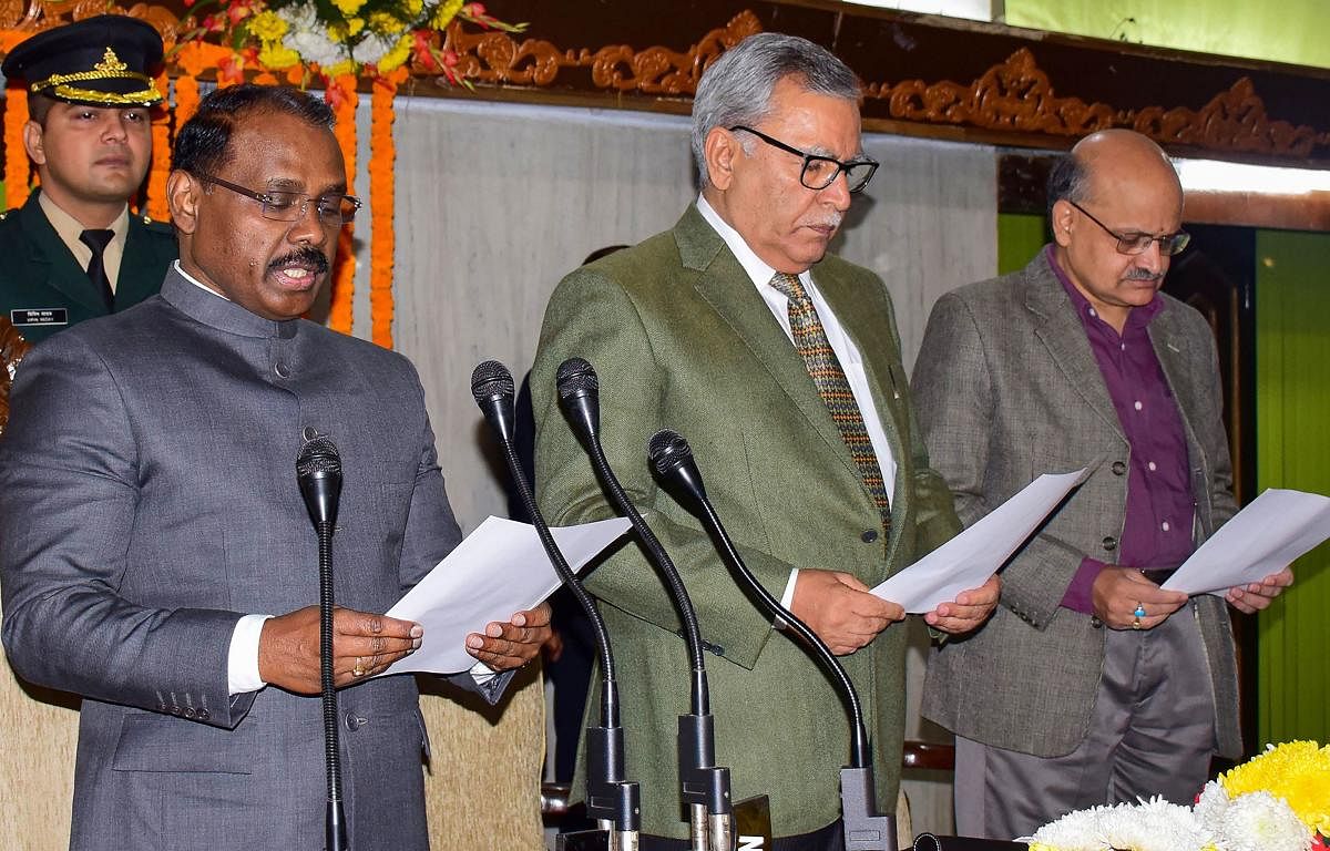 J & K Lt. Governor Girish Chandra Murmu reads out the 'Preamble' of the Constitution along with the officials during a celebration of Constitution Day at Assembly Complex in Jammu, Tuesday, Tuesday, Nov. 26, 2019. PTI 
