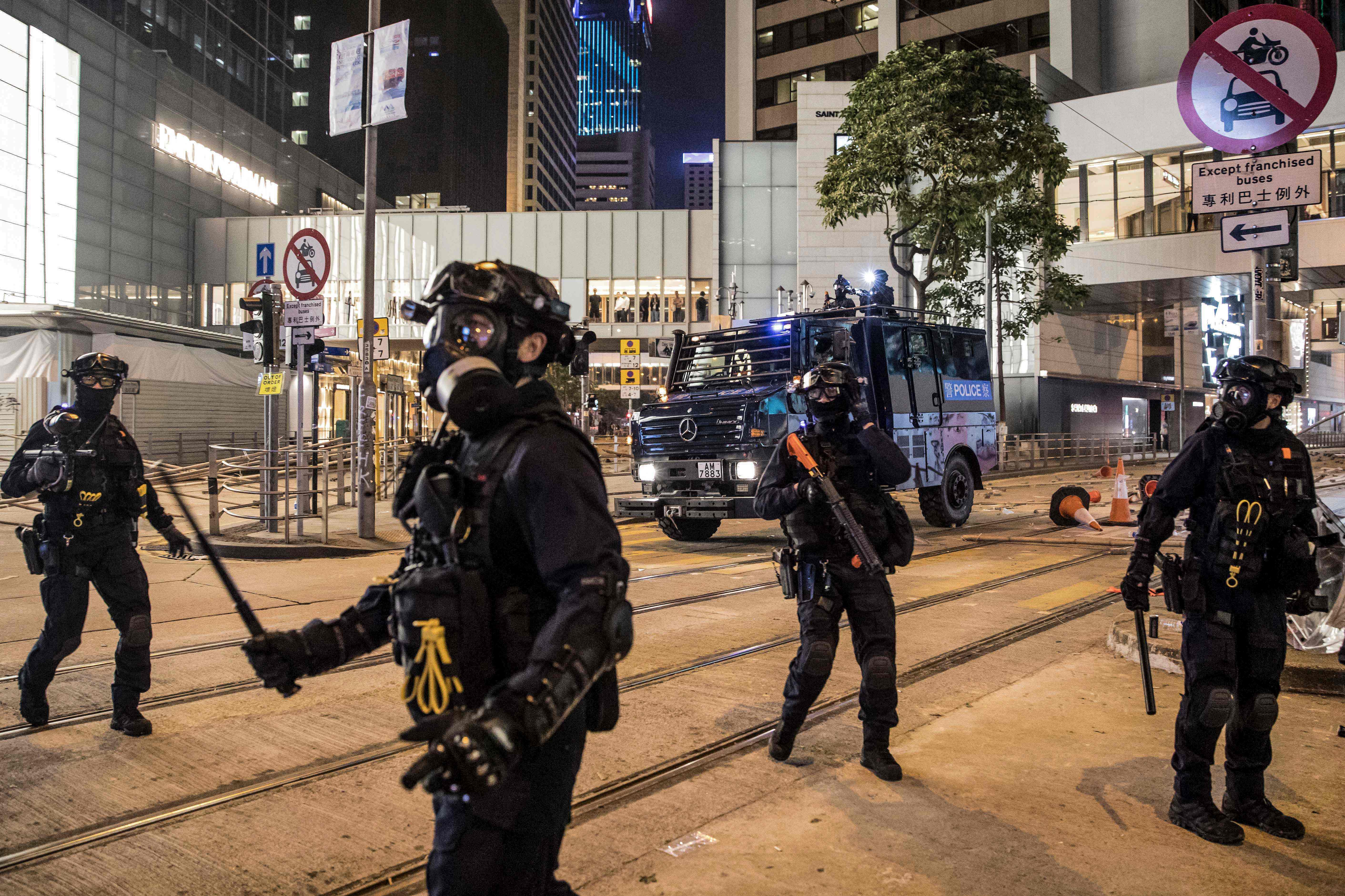 Riot police secure a road after clearing protesters in the Central district in Hong Kong on November 13, 2019. (AFP Photo)