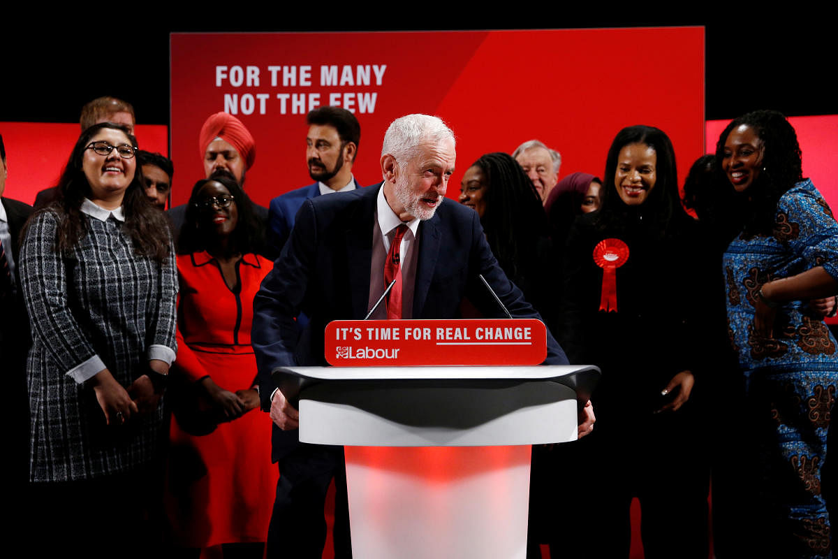 Britain's opposition Labour Party leader Jeremy Corbyn poses with fellow politicians at the Bernie Grant Arts Centre in London, Britain. (Reuters Photo)