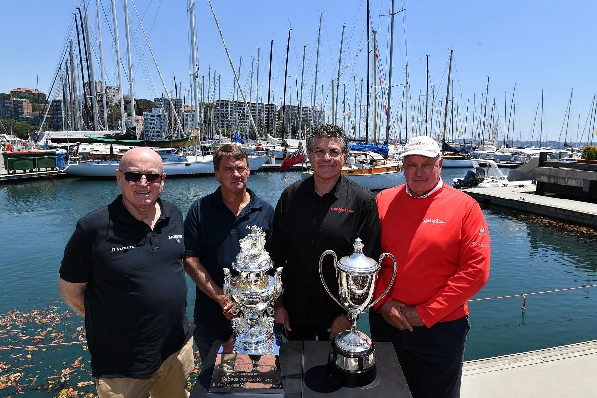 Sydney-Hobart race owners and skippers, (L-R) Bill Barry-Cotter of Katwinchar, Sean Langman of Naval Group, Jim Cooney of Comanche and Iain Murray of Wild Oats XI, pose for a photo in front of trophies at the official launch of the Sydney to Hobart yacht