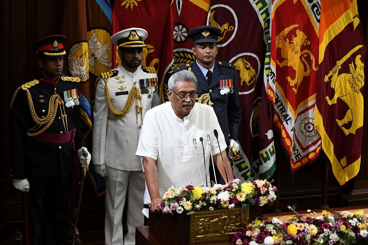 Sri Lanka's President Gotabaya Rajapaksa (C) speaks during a swearing-in ceremony of his bother, Chamal Rajapaksa as country's state minister of defence, in Colombo on November 27, 2019.  (AFP Photo)