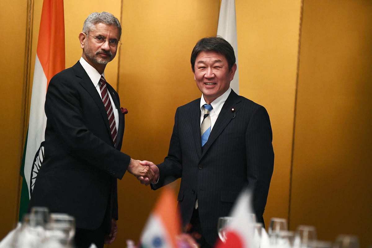 Japanese Foreign Minister Toshimitsu Motegi, right, poses with Indian Minister of External Affairs Subrahmanyam Jaishankar for photographers during a bilateral meeting ahead of the G20 Foreign Ministers' meeting in Nagoya, central Japan
