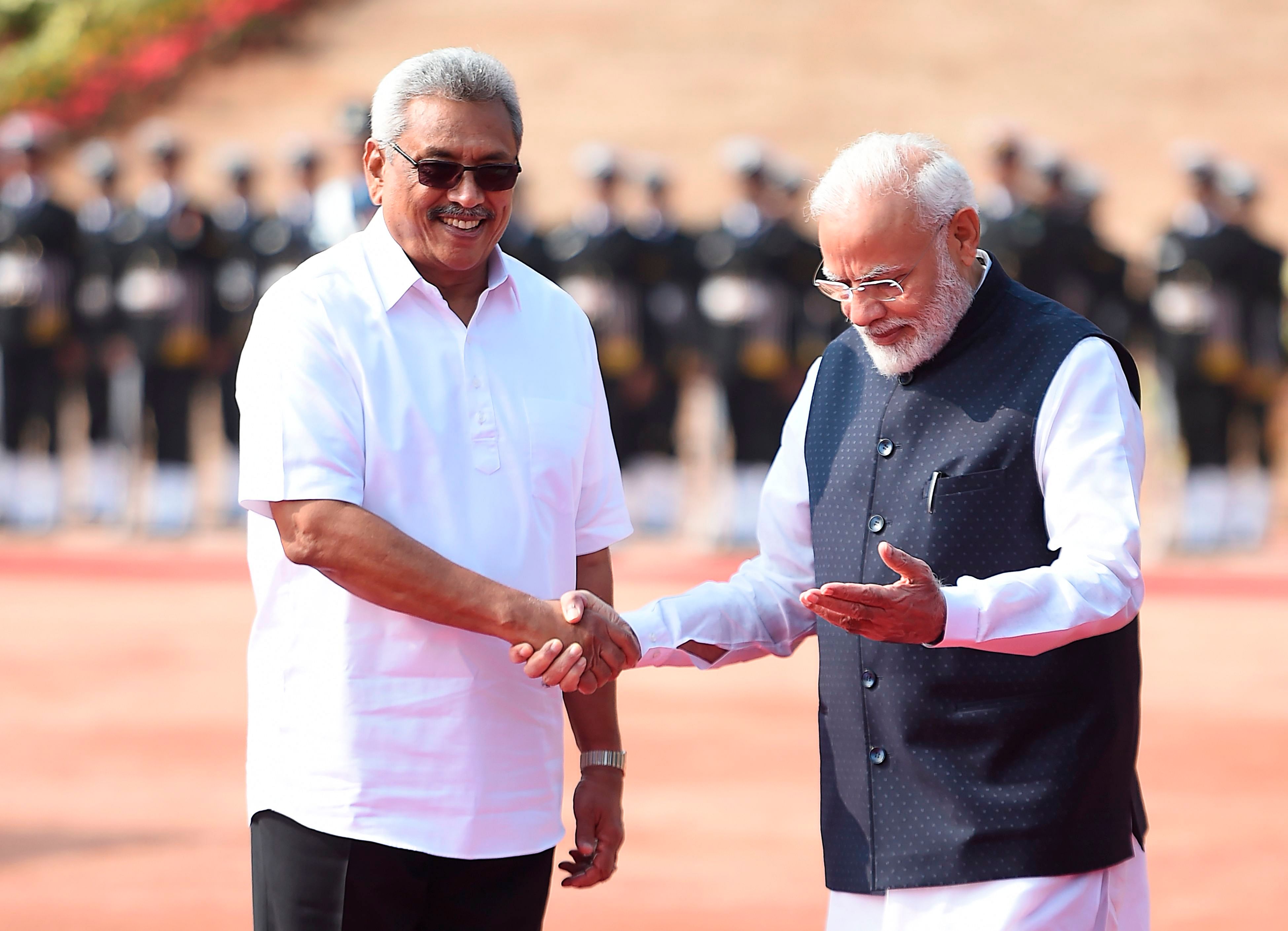 Sri Lanka's President Gotabaya Rajapaksa (L) shakes hands with India's Prime Minister Narendra Modi during a ceremonial reception at the Indian Presidential House in New Delhi on November 29, 2019. (AFP Photo)