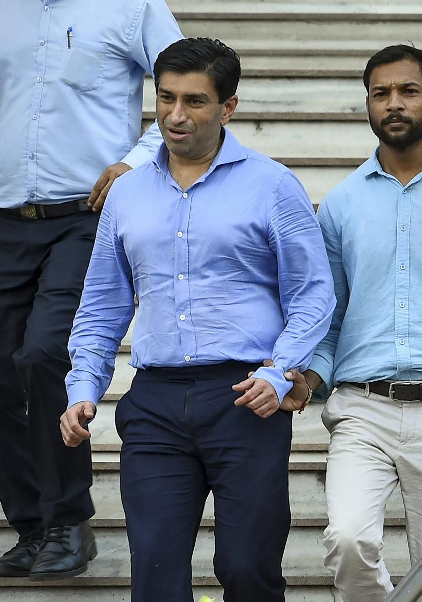 Madhya Pradesh Chief Minister Kamal Nath's nephew Ratul Puri leaves Enforcement Directorate office after being arrested in connection with a Rs 354 crore bank loan fraud case. (PTI Photo)