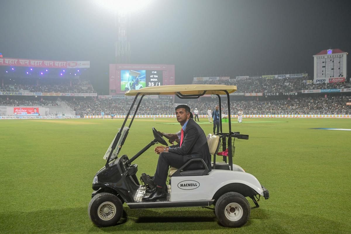 Former Indian cricket captain Rahul Dravid rides in a golf cart during a break on the first day of the second Test cricket match of a two-match series between India and Bangladesh at The Eden Gardens cricket stadium in Kolkata on November 22, 2019. (AFP Photo)