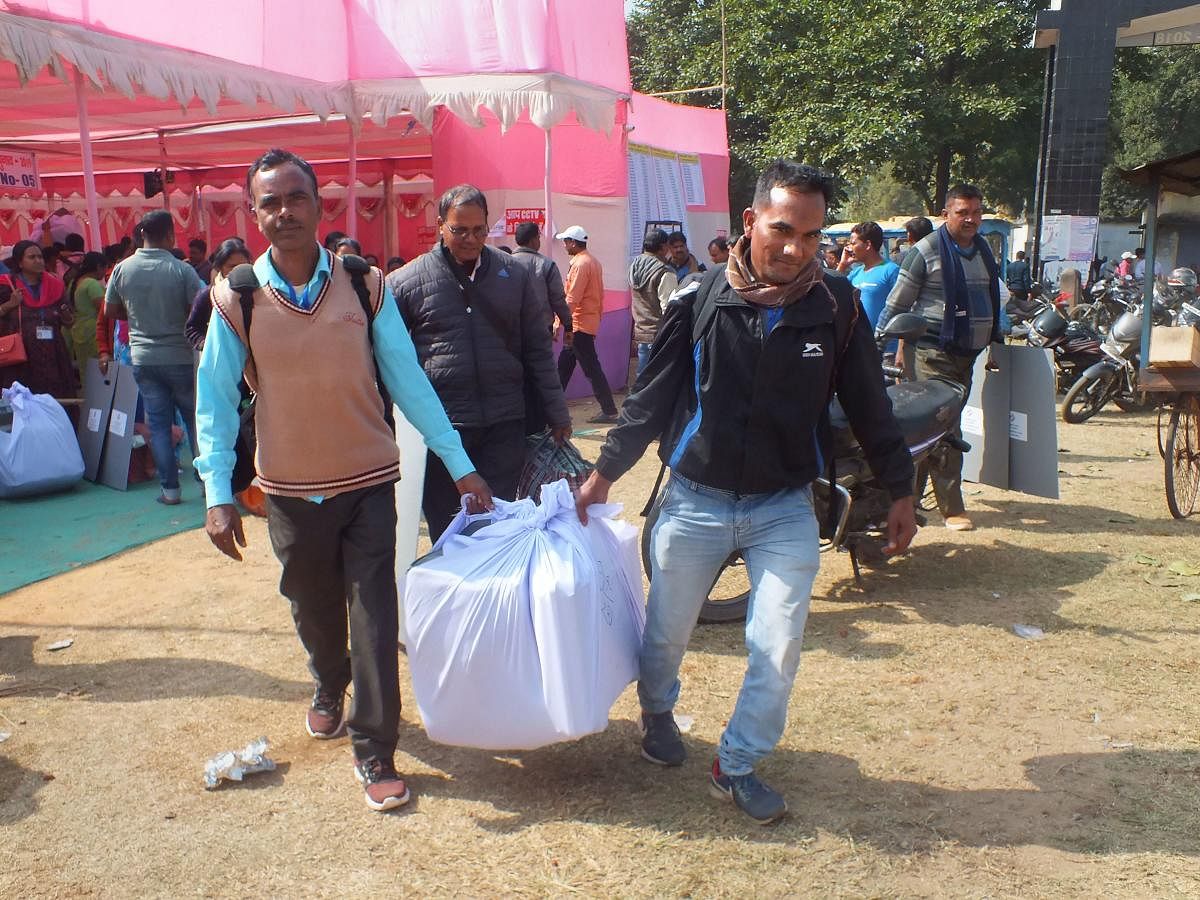 Officials carry election material as they leave for their polling stations ahead of the Jharkhand Assembly elections, in Latehar district, Friday, Nov. 29, 2019. (PTI Photo)