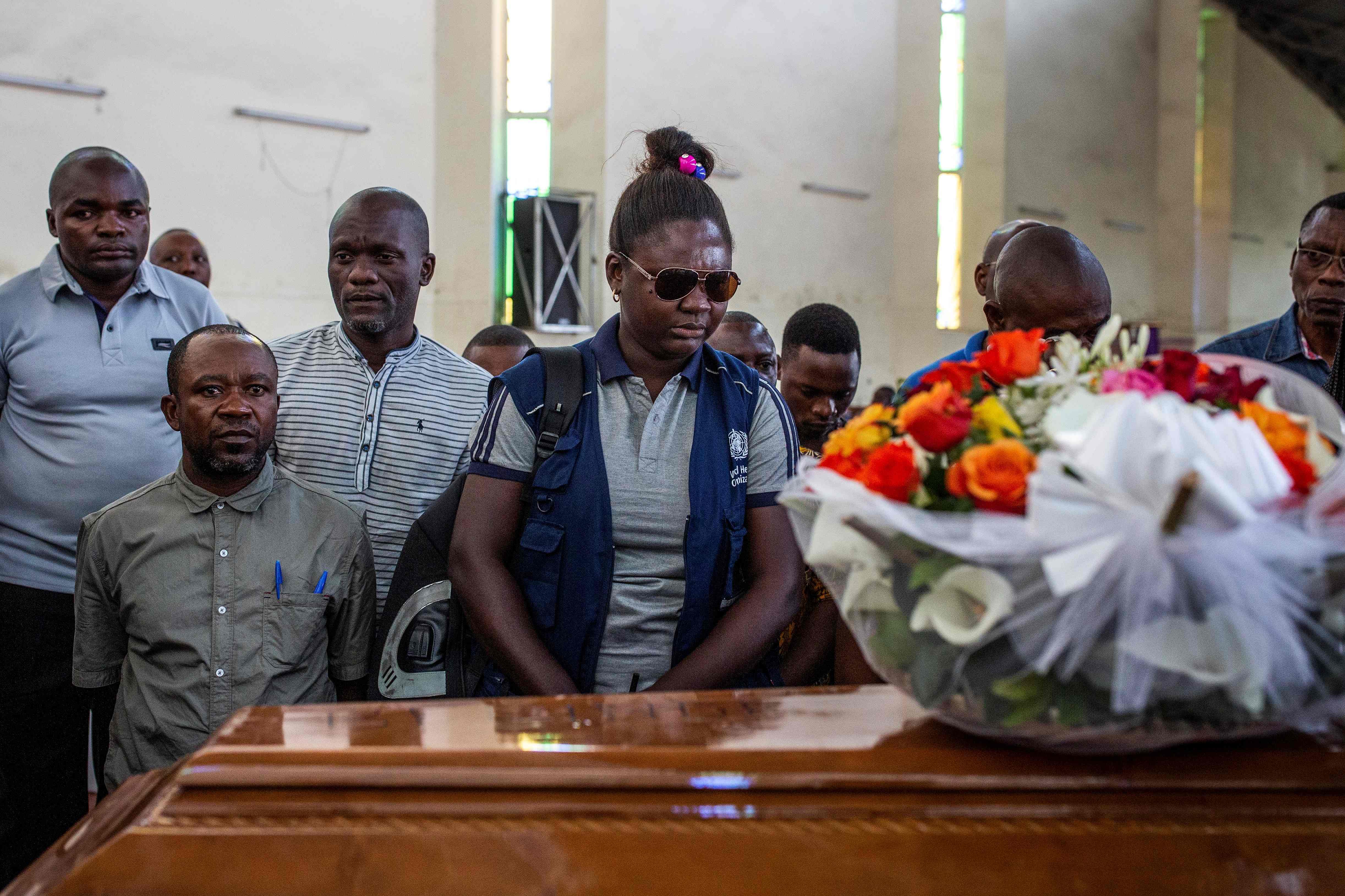Family and colleagues of Belinda Kasongo, 30, who was part of the Ministry of Health vaccination team and was killed by armed men. (AFP Photo)