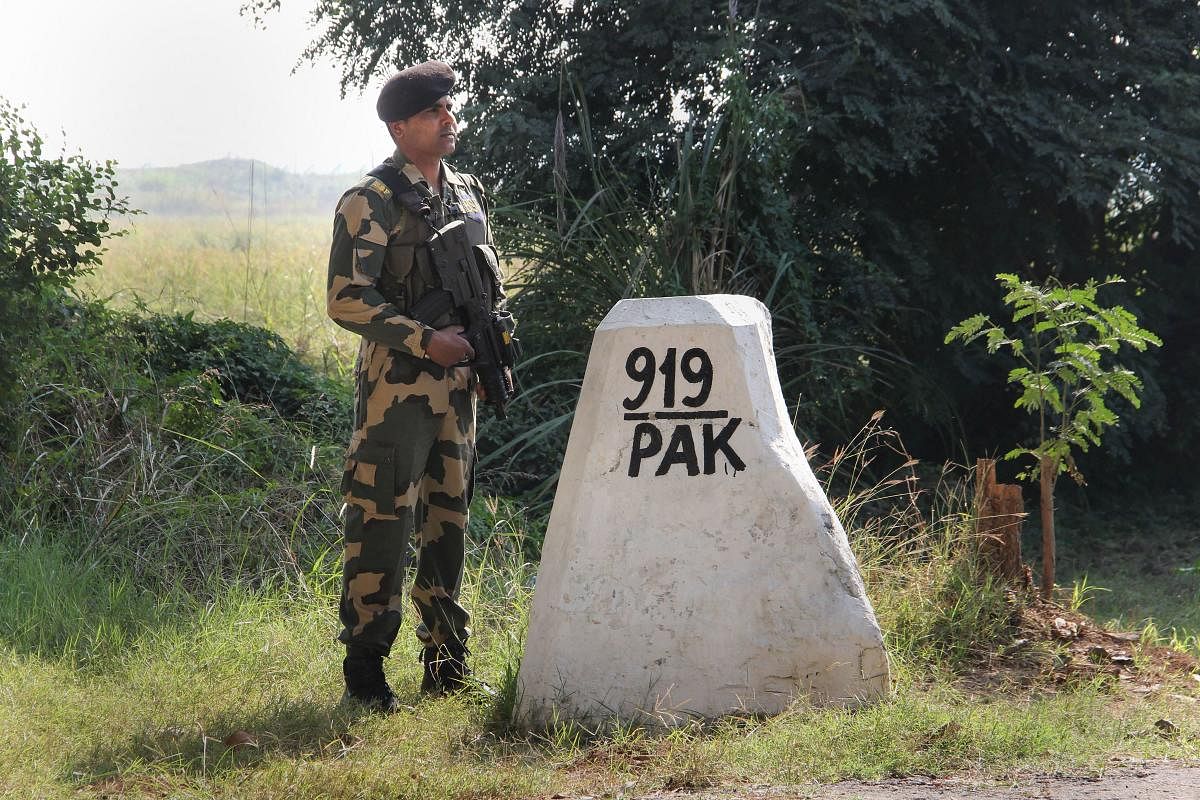 Border Security Force (BSF) jawan stand guard at India-Pakistan International border, at Ranbir Singh Pura in Jammu, Monday, Nov. 18, 2019. (PTI Photo)