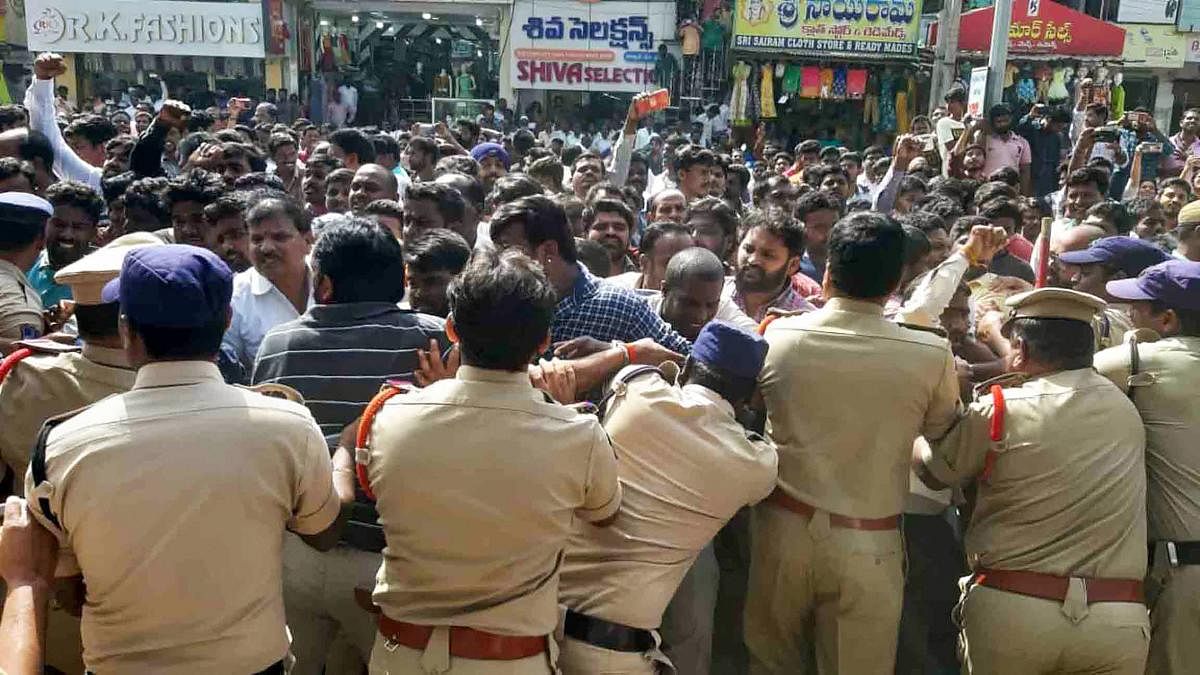 Protestors and police clash during a demonstration demanding justice for P Priyanka Reddy, who was working as an assistant veterinarian at a state-run hospital and whose charred remains was found under a culvert, in Hyderabad, Saturday, Nov. 30, 2019. (PTI Photo)