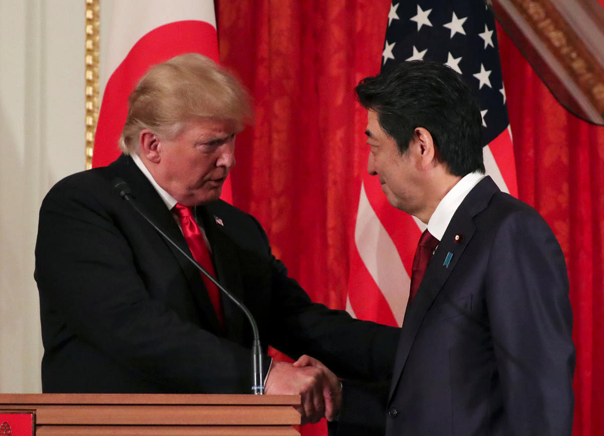 US President Donald Trump shakes hands with Japan's Prime Minister Shinzo Abe (Reuters Photo)