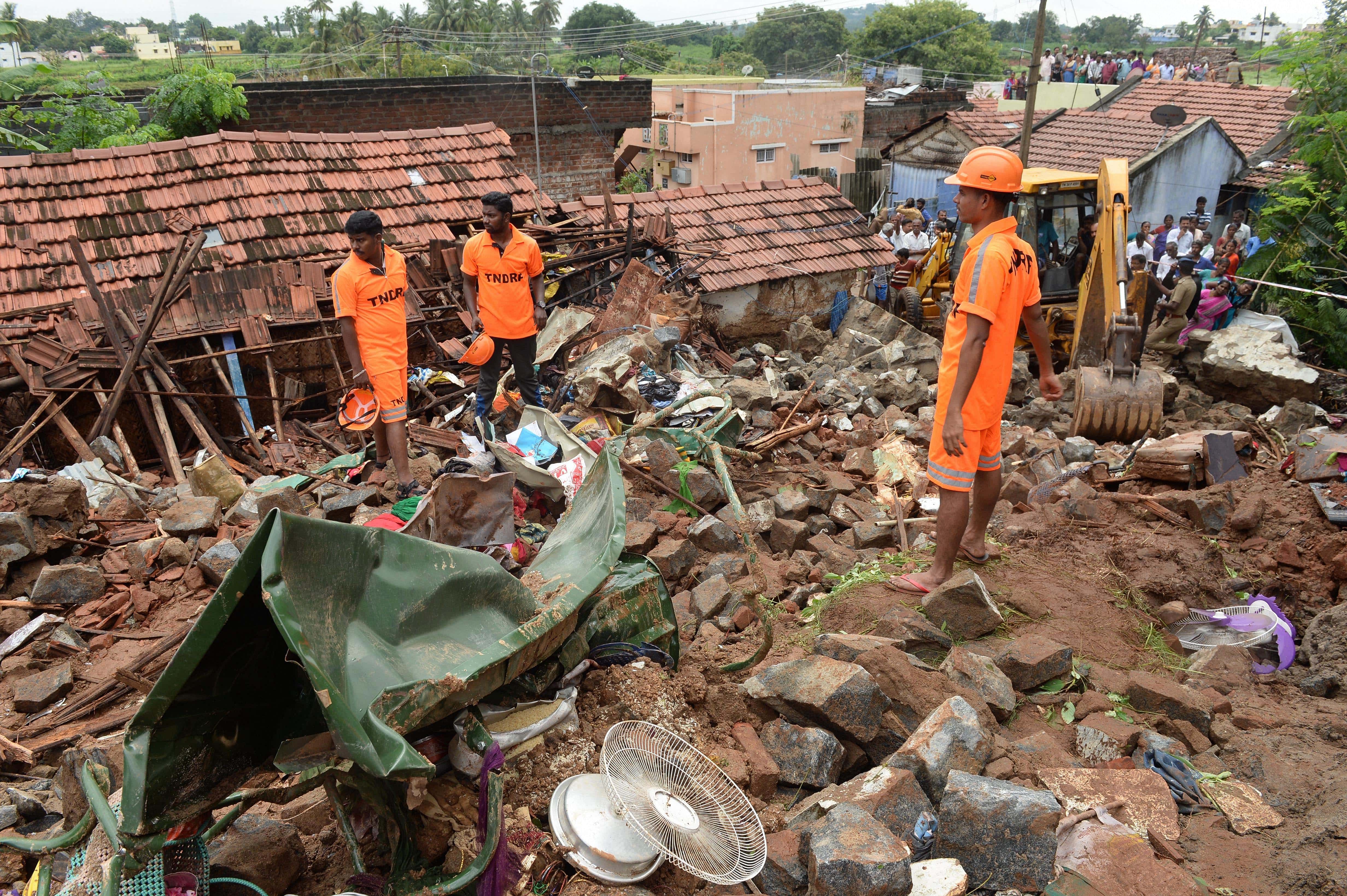 TNDRF personnel carry out rescue works at the site of the wall collapse in Nadur village of Mettupalayam taluk, near Coimbatore, Monday, Dec. 2, 2019. (PTI Photo)