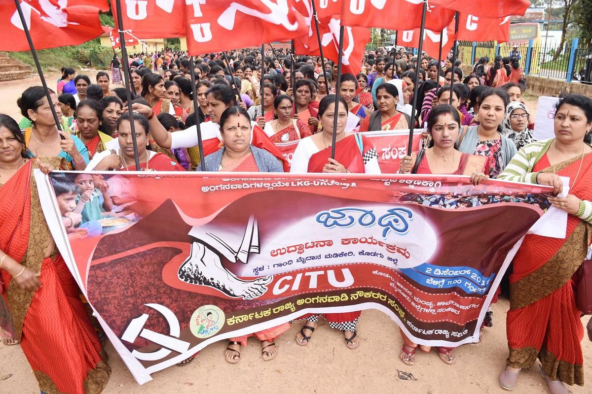 Under the aegis of CITU, anganwadi workers take out a rally in Madikeri on Monday.