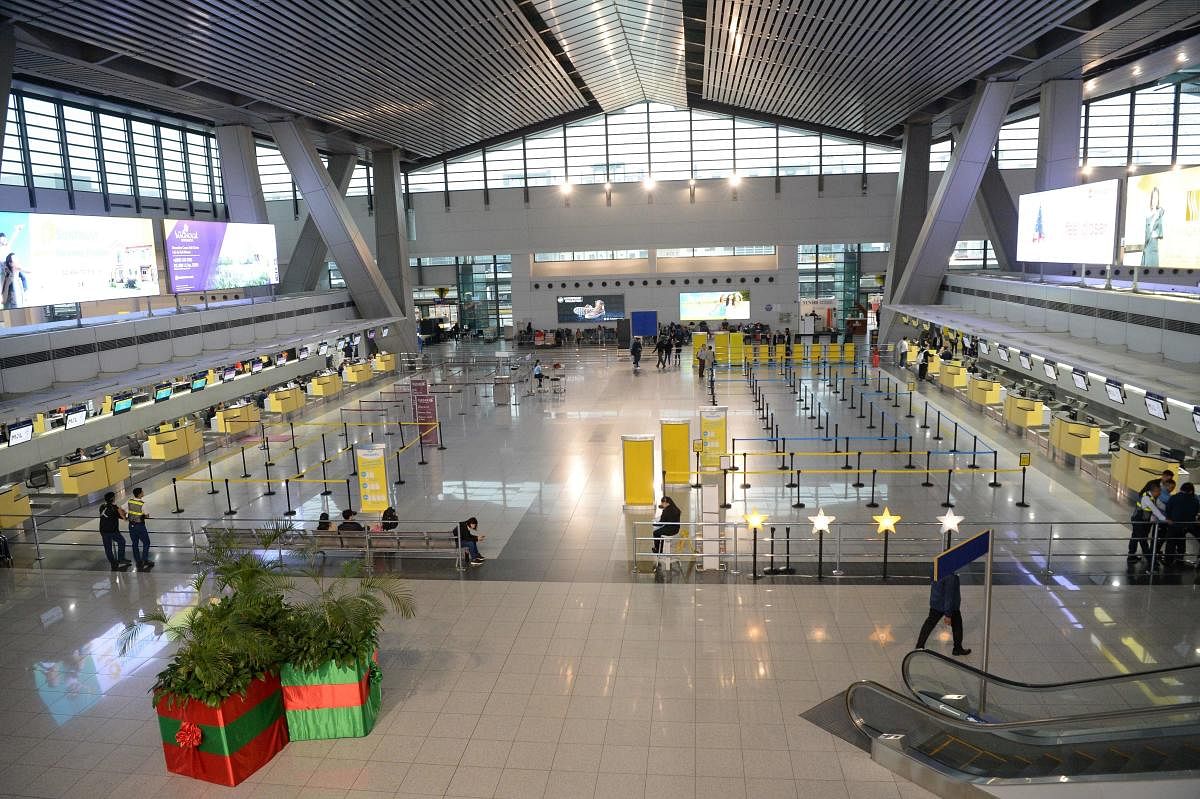 A general view of empty airline check-in counters inside the terminal three of the Manila international airport, hours before the deadline of the closure of the airport due to Typhoon Kammuri. Typhoon Kammuri lashed the Philippines with fierce winds and h