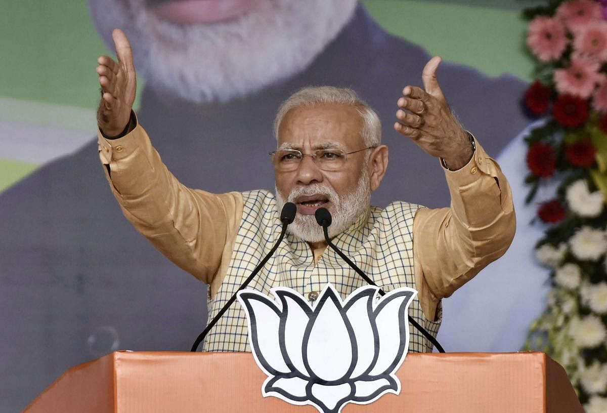 Prime Minister Narendra Modi gestures as he speaks during an election campaign at Khunti district of Jharkhand. Photo by PTI.
