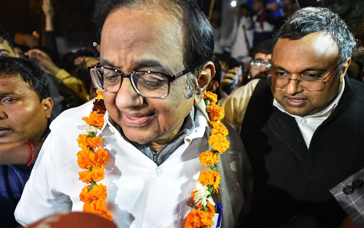 Senior Congress leader P Chidambaram being greeted by the party workers and supporters as he comes out after he was released from Tihar jail in New Delhi, Wednesday night, Dec. 4, 2019. The Supreme Court on Wednesday granted bail to Chidambaram in the INX Media money laundering case. (PTI Photo/Arun Sharma)