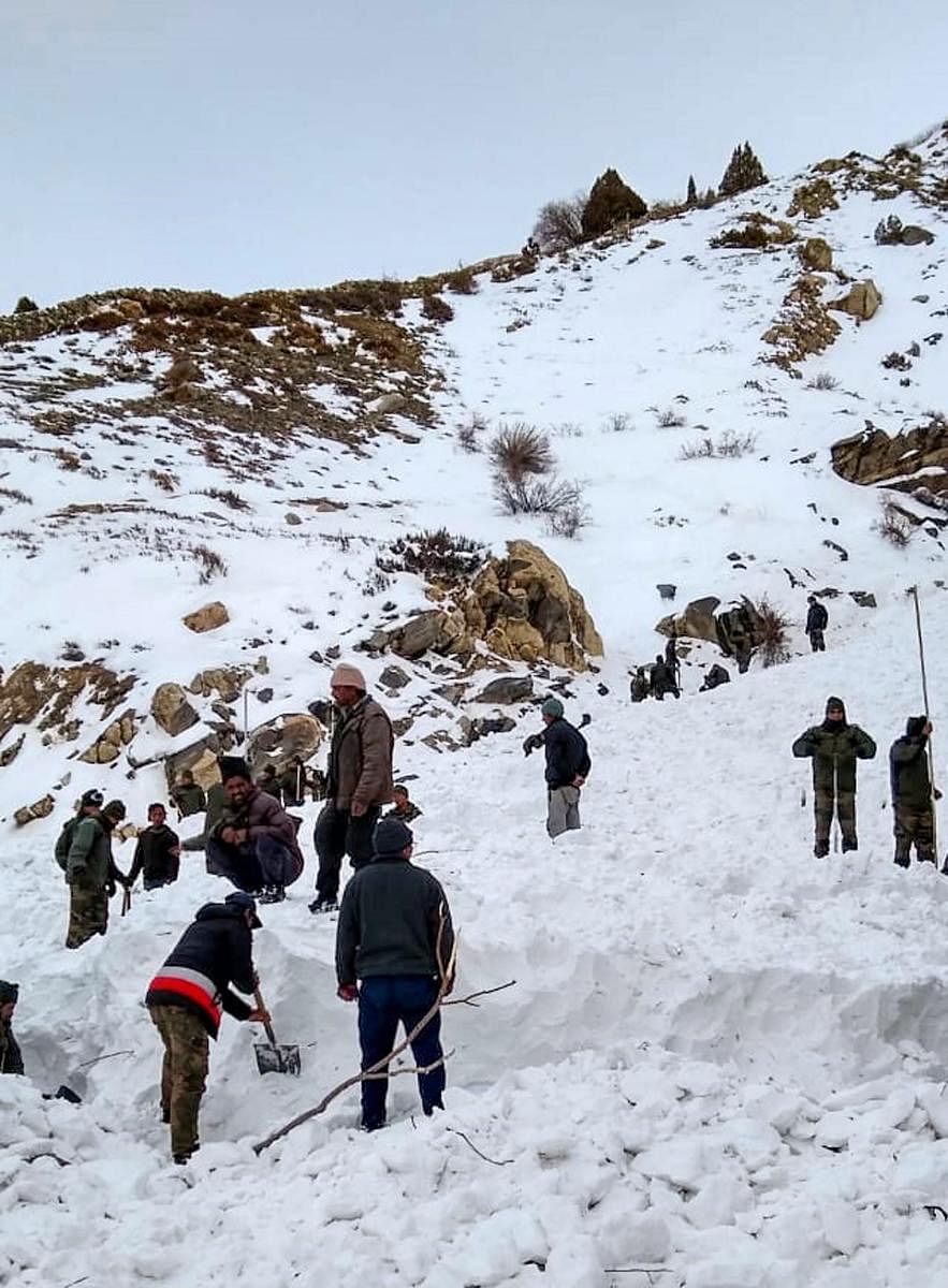 Rescue officials conduct operation after four jawans were trapped in snow due to avalanche. Photo by PTI.