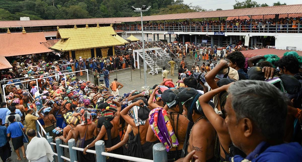 Devotees will be advised to keep their mobile phones switched off and those who use a mobile phone at the temple premises will be initially warned and stringent actions like the seizure of phones would be initiated against repeated violators, N Vasu, president of the Travancore Devaswom Board that manages the temple, told DH. Photo/PTI