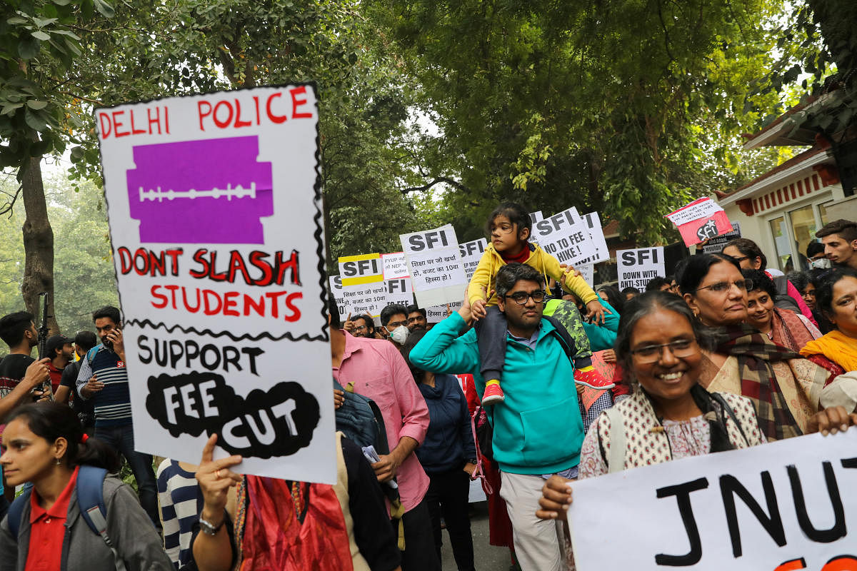 Students and teachers hold placards as they take part in a protest against a proposed fee hike in Jawaharlal Nehru University (JNU), in New Delhi, India, November 23, 2019. (Reuters Photo)