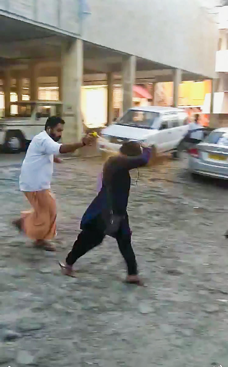 Activist Bindu Ammini, being attacked by a man outside the office of the commissioner of Police. 