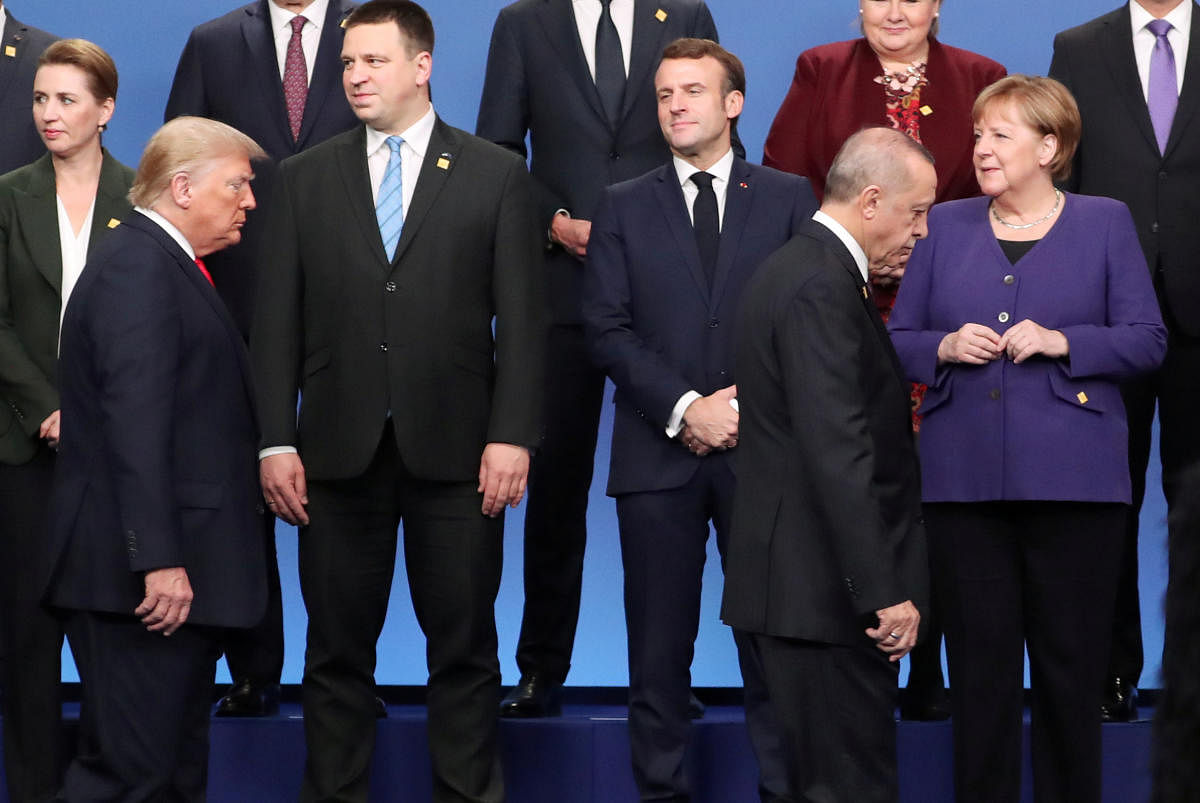 Germany's Chancellor Angela Merkel, Turkey's President President Tayyip Erdogan, U.S. President Donald Trump and France's President Emmanuel Macron during the photo opportunity at the NATO leaders summit in Watford, Britain December 4, 2019. Photo/REUTERS