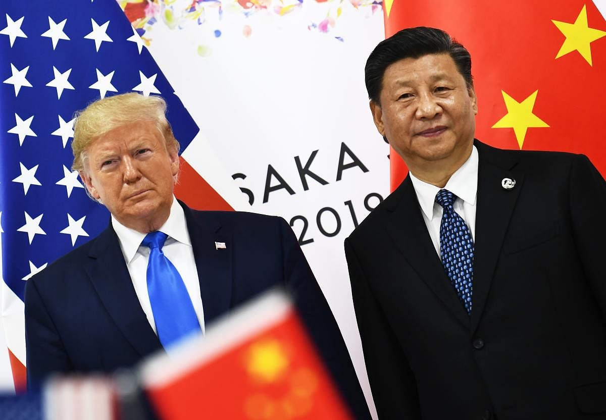 In this file photo taken on June 29, 2019 Chinese President Xi Jinping (R) and US President Donald Trump attend their bilateral meeting on the sidelines of the G20 Summit in Osaka, Japan. (AFP Photo)