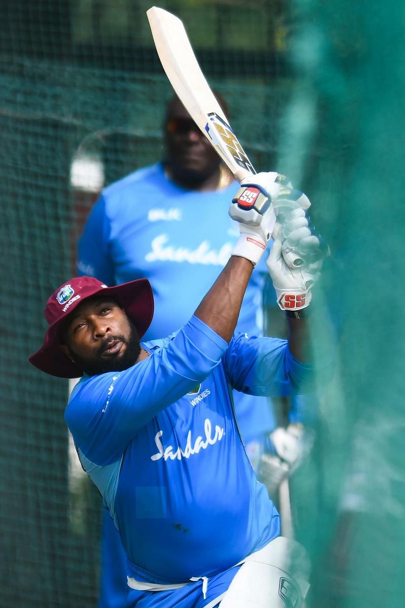 West Indies' cricket team captain Kieron Pollard plays a shot during a practice session ahead of the first T20 international cricket match of a three-match series between India and West Indies at the Rajiv Gandhi International Cricket Stadium. (AFP Photo)