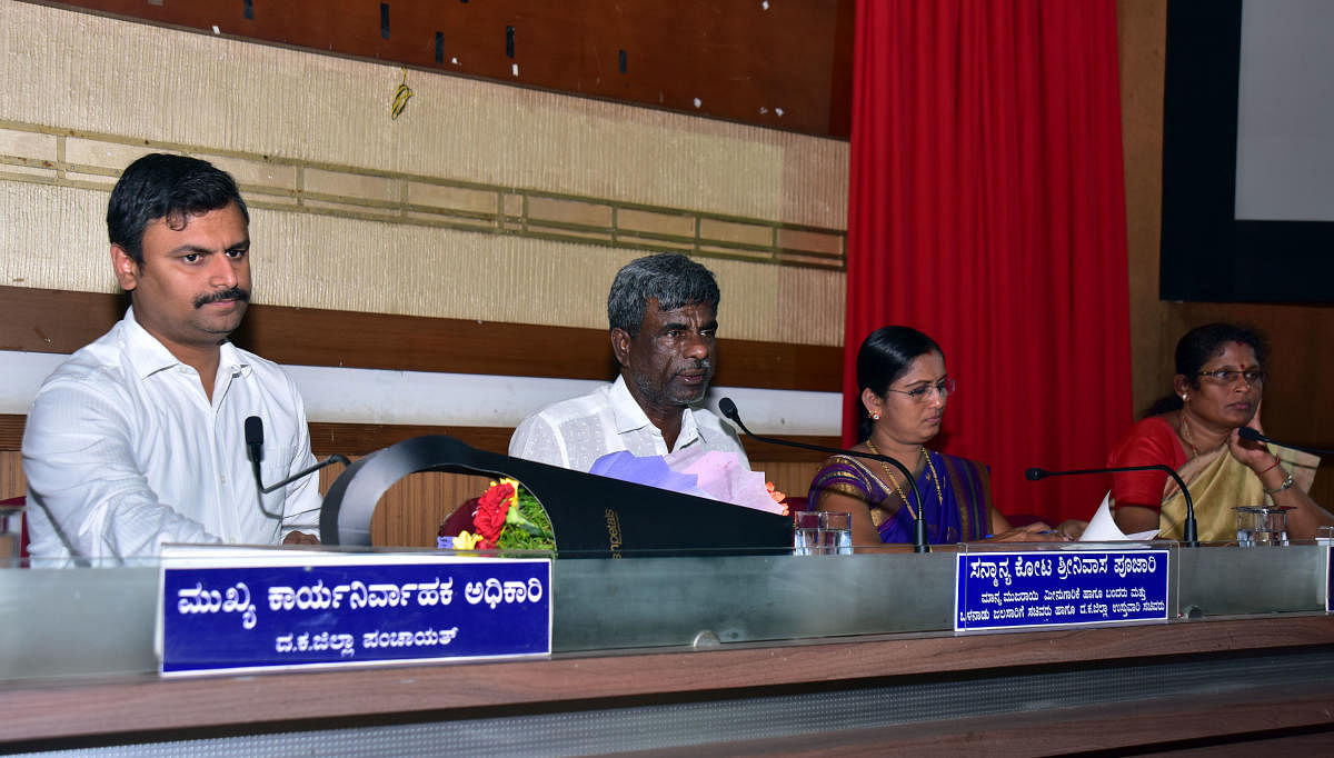 District In-charge Minister Kota Srinivas Poojary chairs a meeting on the progress of housing schemes in the district in Zilla Panchayat auditorium in Mangaluru on Thursday. Dakshina Kannada Zilla Panchayat President Meenakshi Shantigodu, Vice President K