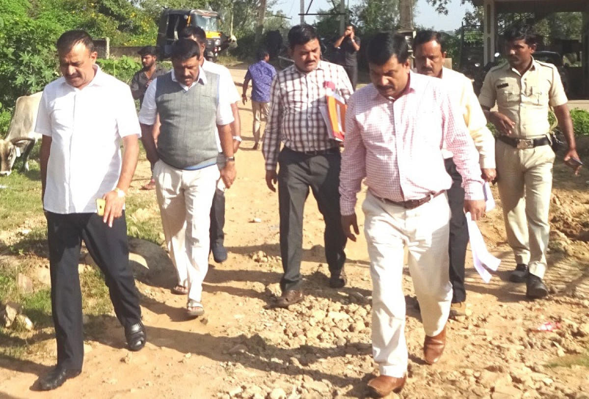 MLA Appachu Ranjan and MLC Sunil Subramani, along with officials inspected roads that were severely affected by floods in Madikeri on Friday. DH Photo