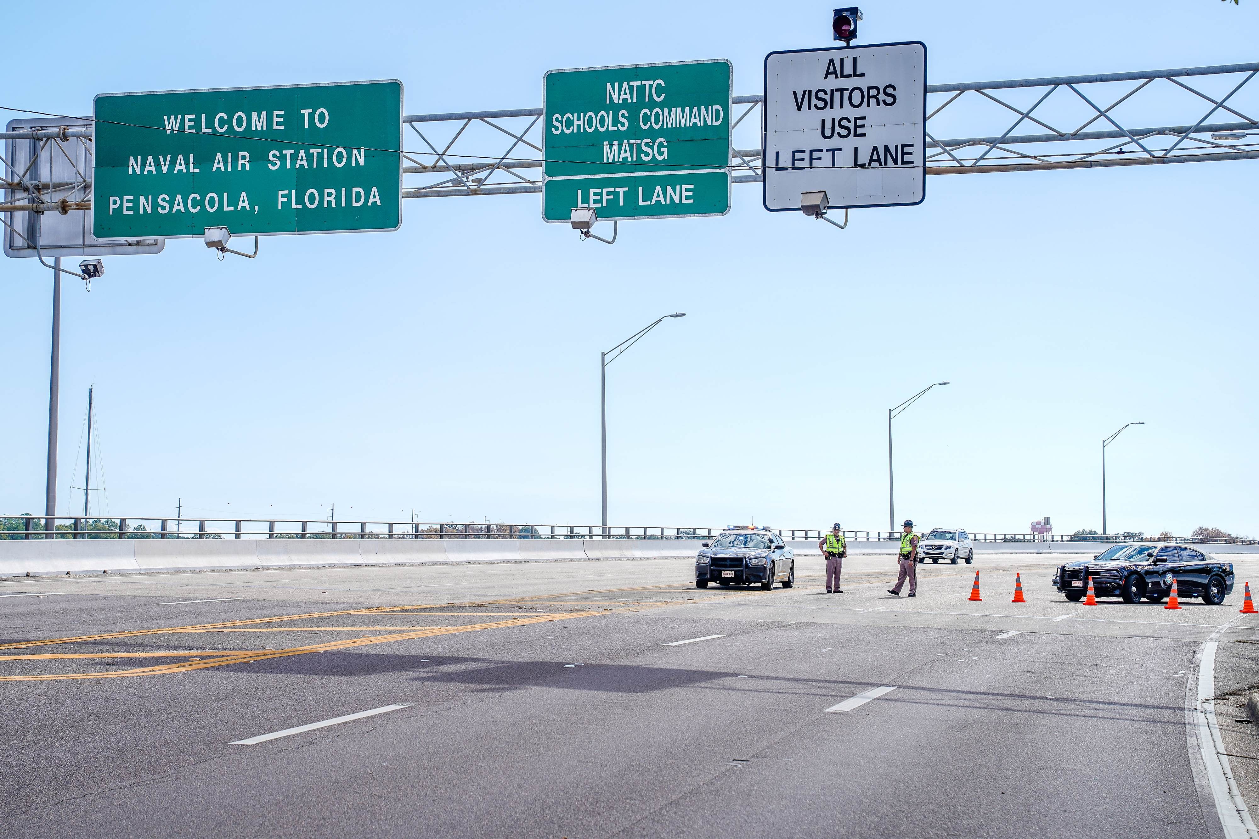  Florida State Troopers block traffic over the Bayou Grande Bridge leading to the Pensacola Naval Air Station following a shooting. (AFP Photo)