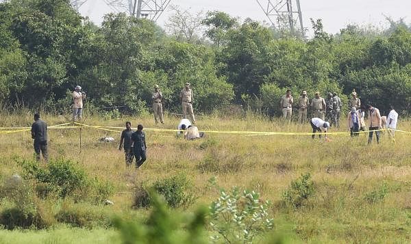  Forensic experts collect evidence from the spot where police shot dead four accused in the rape-and-murder case of a 25-year-old woman veterinarian, at Shadnagar of Ranga Reddy district in Hyderabad, Friday, Dec. 6, 2019. (PTI photo)